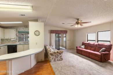 Welcome home to this mmaculate move-in-ready 2 bedroom 2 bath on Barefoot Bay Golf Course in Florida - for sale on GolfHomes.com, golf home, golf lot