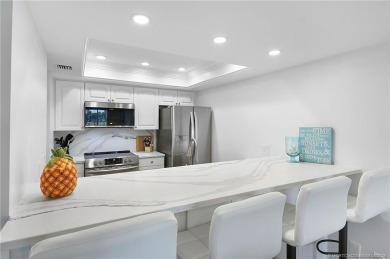 Discover coastal living at its finest in this fully updated on Ocean Club At the Hutchinson Island Beach Resort in Florida - for sale on GolfHomes.com, golf home, golf lot