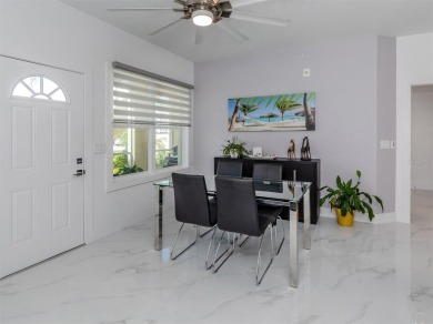 Modern, chic, first floor condo that is 3 years young and ready on Bird Bay Executive Golf Club in Florida - for sale on GolfHomes.com, golf home, golf lot