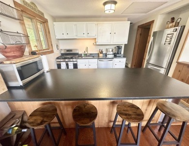 Welcome to this beautifully updated 3-bedroom, 2-bathroom home on Hermitage Club Golf Course in Vermont - for sale on GolfHomes.com, golf home, golf lot