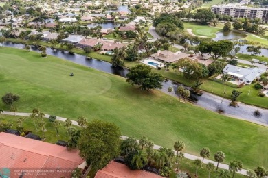 Impeccably remodeled, this 5-bedroom, 4.5-bathroom home, in the on Deer Creek Golf Club in Florida - for sale on GolfHomes.com, golf home, golf lot