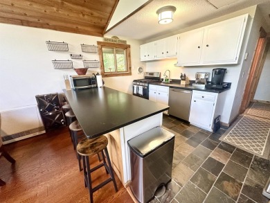 Welcome to this beautifully updated 3-bedroom, 2-bathroom home on Hermitage Club Golf Course in Vermont - for sale on GolfHomes.com, golf home, golf lot
