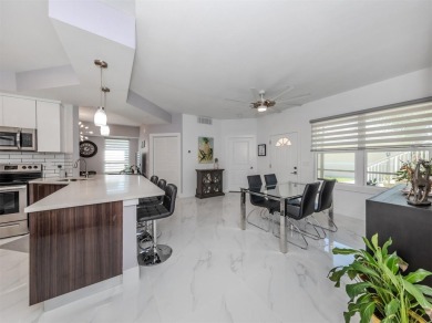 Modern, chic, first floor condo that is 3 years young and ready on Bird Bay Executive Golf Club in Florida - for sale on GolfHomes.com, golf home, golf lot