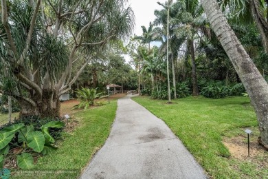 Impeccably remodeled, this 5-bedroom, 4.5-bathroom home, in the on Deer Creek Golf Club in Florida - for sale on GolfHomes.com, golf home, golf lot