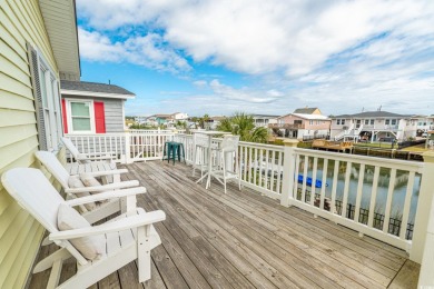 Paradise Palms is a stunning raised beach, channel house located on Beachwood Golf Club in South Carolina - for sale on GolfHomes.com, golf home, golf lot