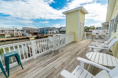 Paradise Palms is a stunning raised beach, channel house located on Beachwood Golf Club in South Carolina - for sale on GolfHomes.com, golf home, golf lot