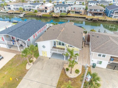 Paradise Palms is a stunning raised beach, channel house located on Beachwood Golf Club in South Carolina - for sale on GolfHomes.com, golf home, golf lot