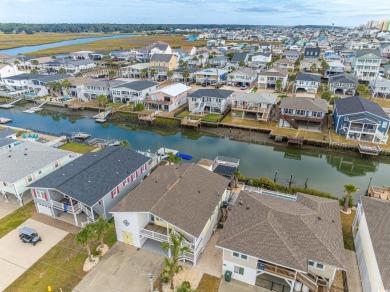 Paradise Palms is a stunning raised beach, channel house located on Beachwood Golf Club in South Carolina - for sale on GolfHomes.com, golf home, golf lot