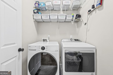 Welcome home to this 6-bedroom, 4-bath home tucked away on a on The Golf Club of Georgia in Georgia - for sale on GolfHomes.com, golf home, golf lot