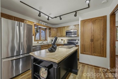 Escape to your own Blue Ridge retreat in the highly sought-after on Land Harbor Golf Course in North Carolina - for sale on GolfHomes.com, golf home, golf lot