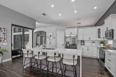 Welcome to a masterfully reimagined residence in the prestigious on Winston Trails Golf Course in Florida - for sale on GolfHomes.com, golf home, golf lot