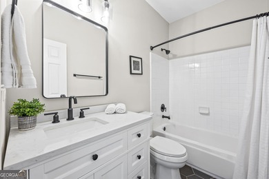 Welcome home to this 6-bedroom, 4-bath home tucked away on a on The Golf Club of Georgia in Georgia - for sale on GolfHomes.com, golf home, golf lot