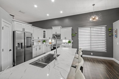 Welcome to a masterfully reimagined residence in the prestigious on Winston Trails Golf Course in Florida - for sale on GolfHomes.com, golf home, golf lot