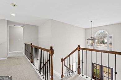 Welcome home to this 6-bedroom, 4-bath home tucked away on a on The Golf Club of Georgia in Georgia - for sale on GolfHomes.com, golf home, golf lot