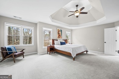 Welcome home to this 6-bedroom, 4-bath home tucked away on a on The Golf Club of Georgia in Georgia - for sale on GolfHomes.com, golf home, golf lot