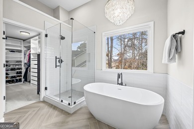 Welcome home to this 6-bedroom, 4-bath home tucked away on a on The Golf Club of Georgia in Georgia - for sale on GolfHomes.com, golf home, golf lot