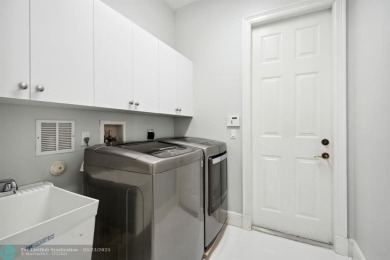 ZEN CONTEMPORARY 6 BED 4 BATH. OVERSIZED LOT, ON LAKE CUL DE SAC on Parkland Golf Club in Florida - for sale on GolfHomes.com, golf home, golf lot