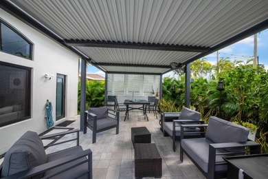 Welcome to a masterfully reimagined residence in the prestigious on Winston Trails Golf Course in Florida - for sale on GolfHomes.com, golf home, golf lot