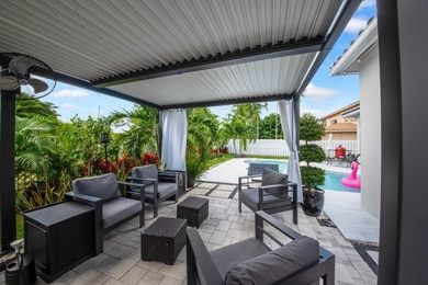 Welcome to a masterfully reimagined residence in the prestigious on Winston Trails Golf Course in Florida - for sale on GolfHomes.com, golf home, golf lot