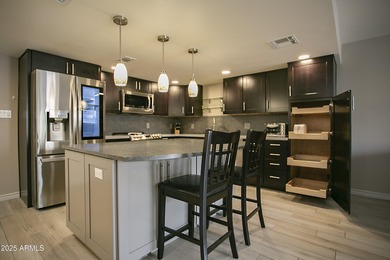 Outstanding open-concept contemporary remodel! Kitchen is chefs on Scottsdale Shadows in Arizona - for sale on GolfHomes.com, golf home, golf lot