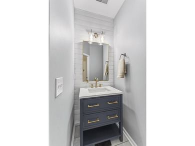 Double front porches set the tone for this thoughtfully updated on Charleston National Golf Club in South Carolina - for sale on GolfHomes.com, golf home, golf lot