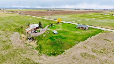A log-style residence sits on the peaceful plains of central on Choteau Country Club in Montana - for sale on GolfHomes.com, golf home, golf lot