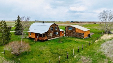 A log-style residence sits on the peaceful plains of central on Choteau Country Club in Montana - for sale on GolfHomes.com, golf home, golf lot