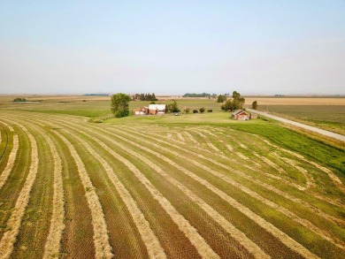 A log-style residence sits on the peaceful plains of central on Choteau Country Club in Montana - for sale on GolfHomes.com, golf home, golf lot