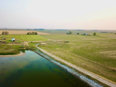 A log-style residence sits on the peaceful plains of central on Choteau Country Club in Montana - for sale on GolfHomes.com, golf home, golf lot