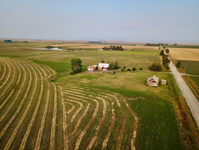 A log-style residence sits on the peaceful plains of central on Choteau Country Club in Montana - for sale on GolfHomes.com, golf home, golf lot