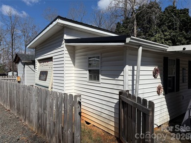 Cute, spacious 2 bedroom, 1 bath unit with lots of sleeping on The Tillery Tradition Country Club in North Carolina - for sale on GolfHomes.com, golf home, golf lot