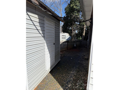 Cute, spacious 2 bedroom, 1 bath unit with lots of sleeping on The Tillery Tradition Country Club in North Carolina - for sale on GolfHomes.com, golf home, golf lot