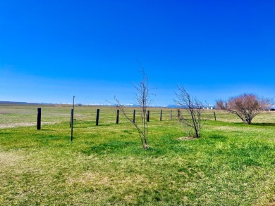 A log-style residence sits on the peaceful plains of central on Choteau Country Club in Montana - for sale on GolfHomes.com, golf home, golf lot