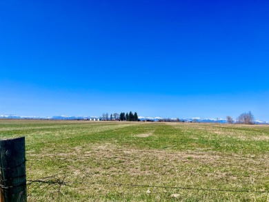 A log-style residence sits on the peaceful plains of central on Choteau Country Club in Montana - for sale on GolfHomes.com, golf home, golf lot