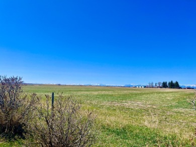 A log-style residence sits on the peaceful plains of central on Choteau Country Club in Montana - for sale on GolfHomes.com, golf home, golf lot