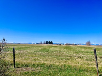 A log-style residence sits on the peaceful plains of central on Choteau Country Club in Montana - for sale on GolfHomes.com, golf home, golf lot