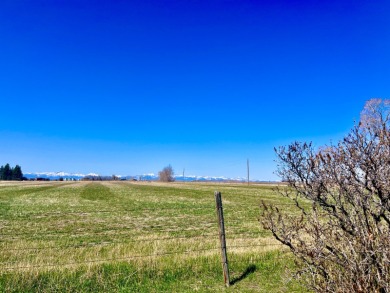 A log-style residence sits on the peaceful plains of central on Choteau Country Club in Montana - for sale on GolfHomes.com, golf home, golf lot