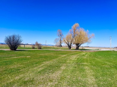 A log-style residence sits on the peaceful plains of central on Choteau Country Club in Montana - for sale on GolfHomes.com, golf home, golf lot