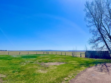 A log-style residence sits on the peaceful plains of central on Choteau Country Club in Montana - for sale on GolfHomes.com, golf home, golf lot