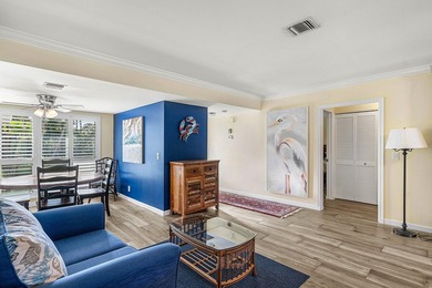 Spacious 3-bedroom, 2-bath condo featuring wood-look tile on Quail Ridge Golf Course and Country Club in Florida - for sale on GolfHomes.com, golf home, golf lot