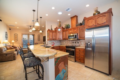 Tucked away in Yuma's South Foothills, this Santa Fe-style home on Las Barrancas Golf Course in Arizona - for sale on GolfHomes.com, golf home, golf lot