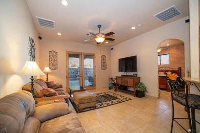 Tucked away in Yuma's South Foothills, this Santa Fe-style home on Las Barrancas Golf Course in Arizona - for sale on GolfHomes.com, golf home, golf lot