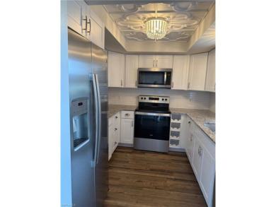 This spacious first-floor condo offers 2 bedrooms and 2 full on Hibiscus Golf Club in Florida - for sale on GolfHomes.com, golf home, golf lot