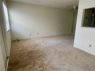Enjoy the breeze on the screened lanai of this 1/1 2nd floor on Pine Lakes Golf Club in Florida - for sale on GolfHomes.com, golf home, golf lot