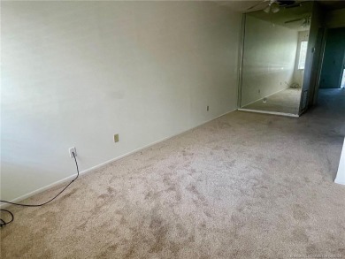 Enjoy the breeze on the screened lanai of this 1/1 2nd floor on Pine Lakes Golf Club in Florida - for sale on GolfHomes.com, golf home, golf lot