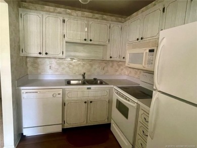 Enjoy the breeze on the screened lanai of this 1/1 2nd floor on Pine Lakes Golf Club in Florida - for sale on GolfHomes.com, golf home, golf lot