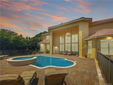 PRIVATE LAKESIDE RETREAT - This updated 5 BR, 6 bath, 4 garage on The Cape Club of Palm City in Florida - for sale on GolfHomes.com, golf home, golf lot