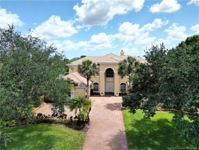PRIVATE LAKESIDE RETREAT - This updated 5 BR, 6 bath, 4 garage on The Cape Club of Palm City in Florida - for sale on GolfHomes.com, golf home, golf lot