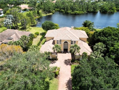 PRIVATE LAKESIDE RETREAT - This updated 5 BR, 6 bath, 4 garage on The Cape Club of Palm City in Florida - for sale on GolfHomes.com, golf home, golf lot