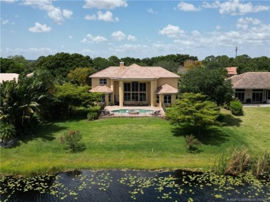 PRIVATE LAKESIDE RETREAT - This updated 5 BR, 6 bath, 4 garage on The Cape Club of Palm City in Florida - for sale on GolfHomes.com, golf home, golf lot